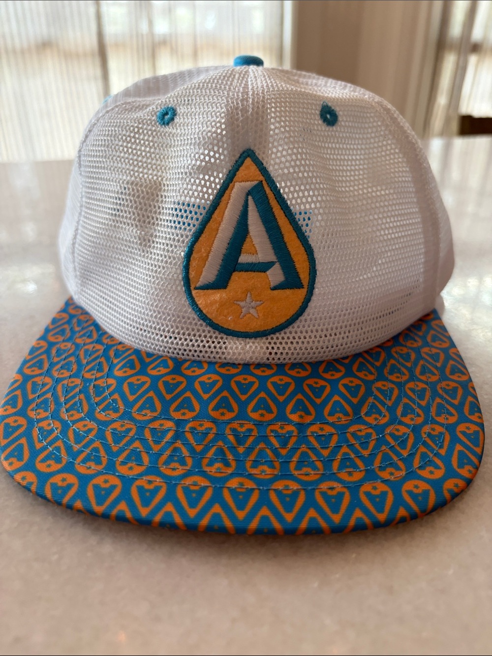 White Mesh Snapback Hat with Teal & Yellow Patterned Brim